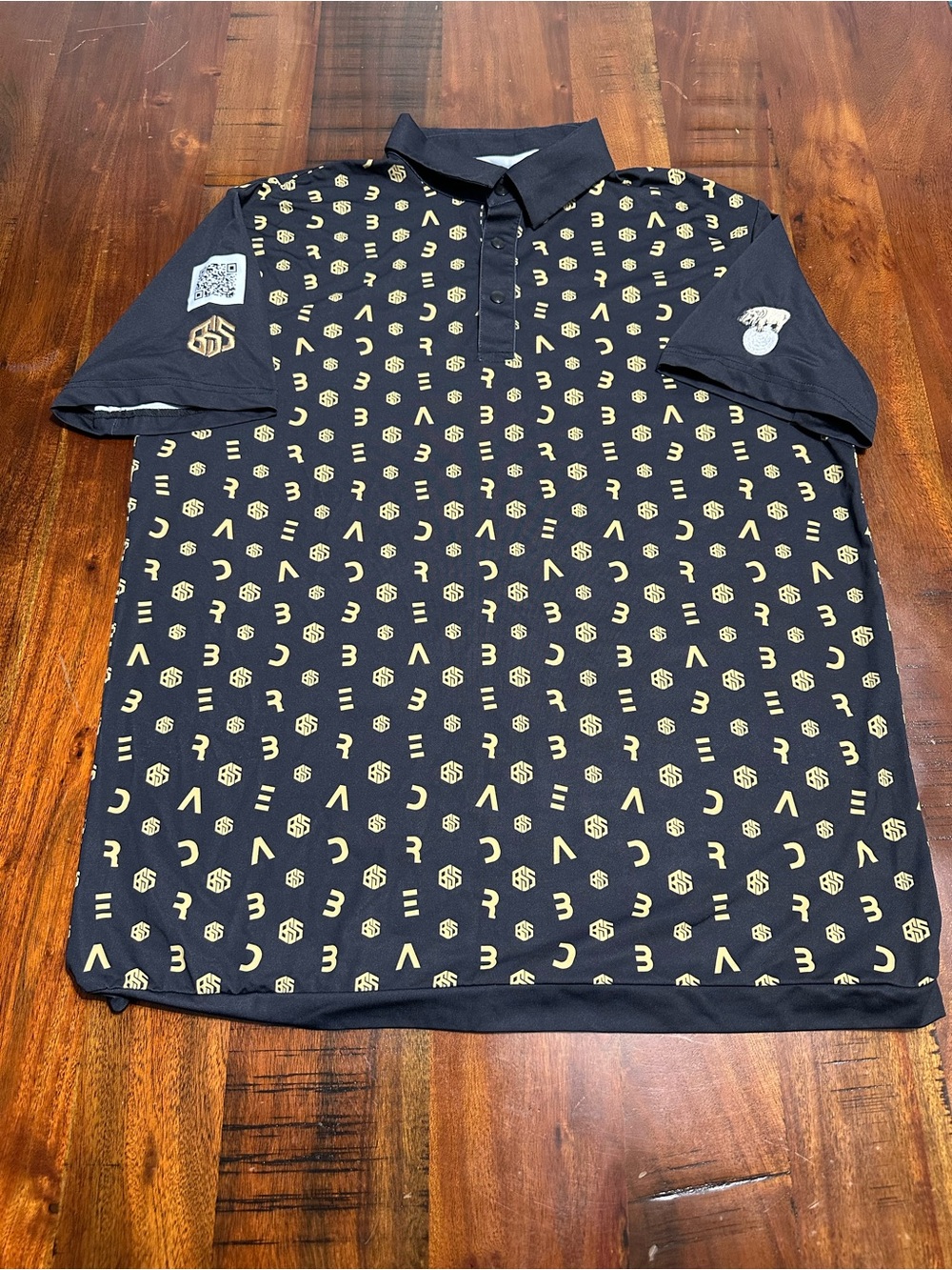 Chippopotamus Men's Black Golf Polo Shirt with Gold Geometric Print